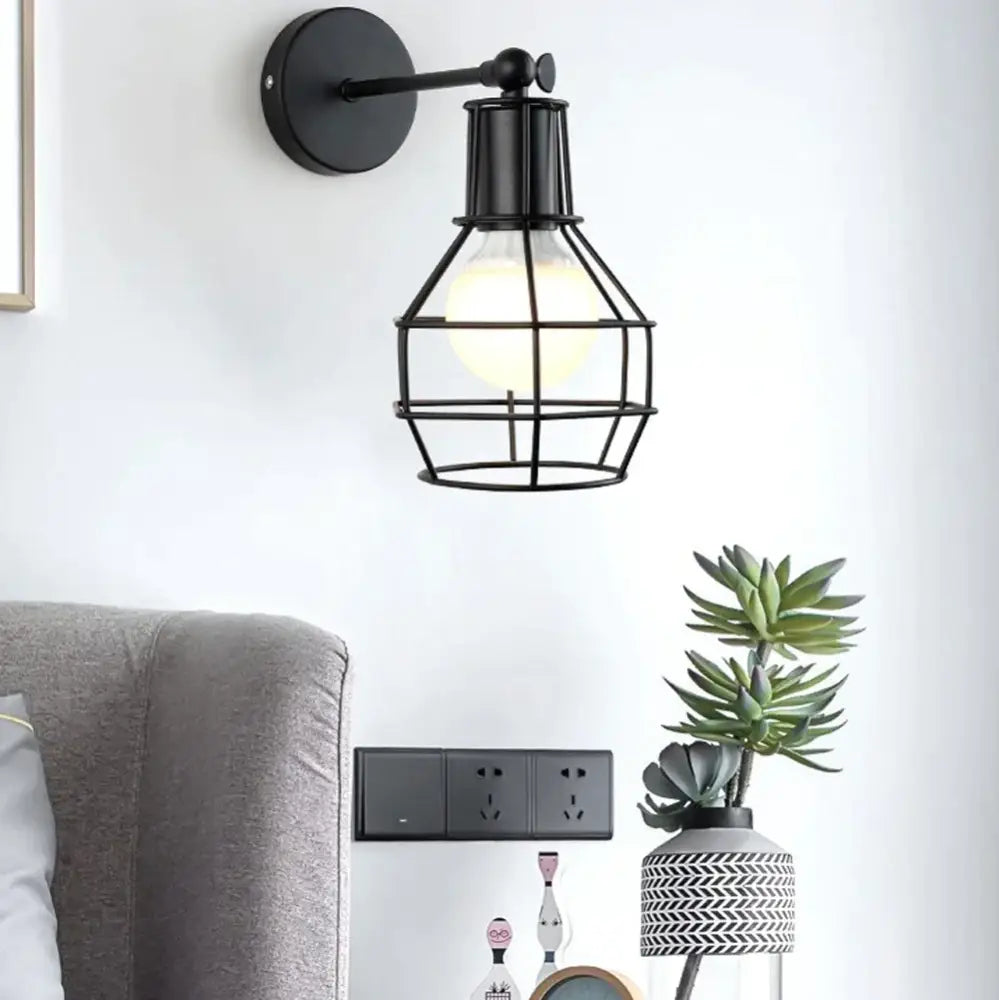 Retro black iron cage wall lamp for bedroom with amber bulb