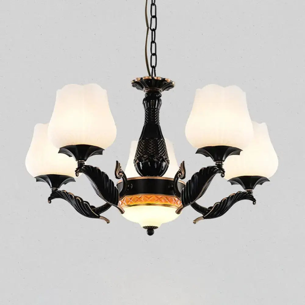 Ornate black & gold chandelier with frosted glass shades dining room