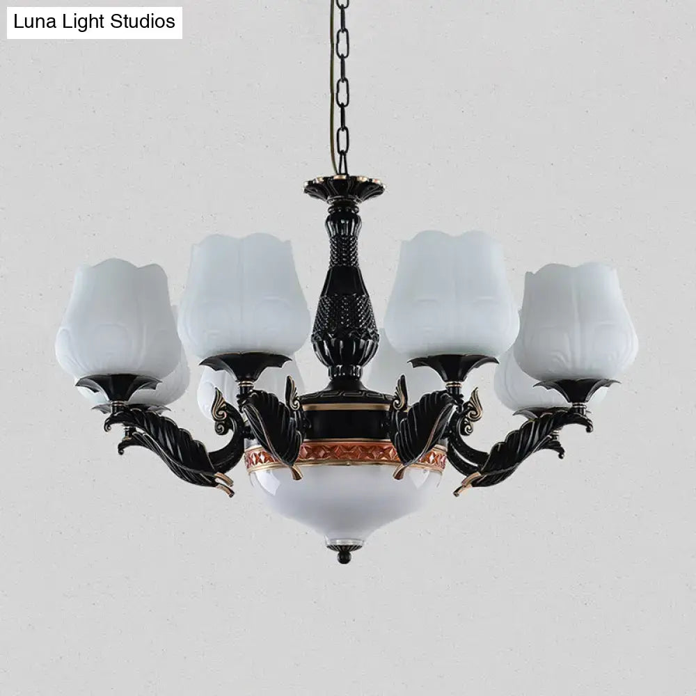 Ornate black & gold chandelier with frosted glass shades dining room