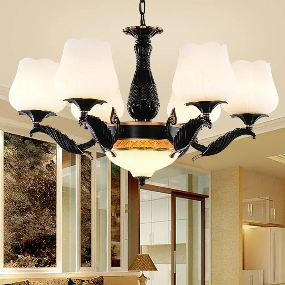 Ornate black & gold chandelier with frosted glass shades dining room