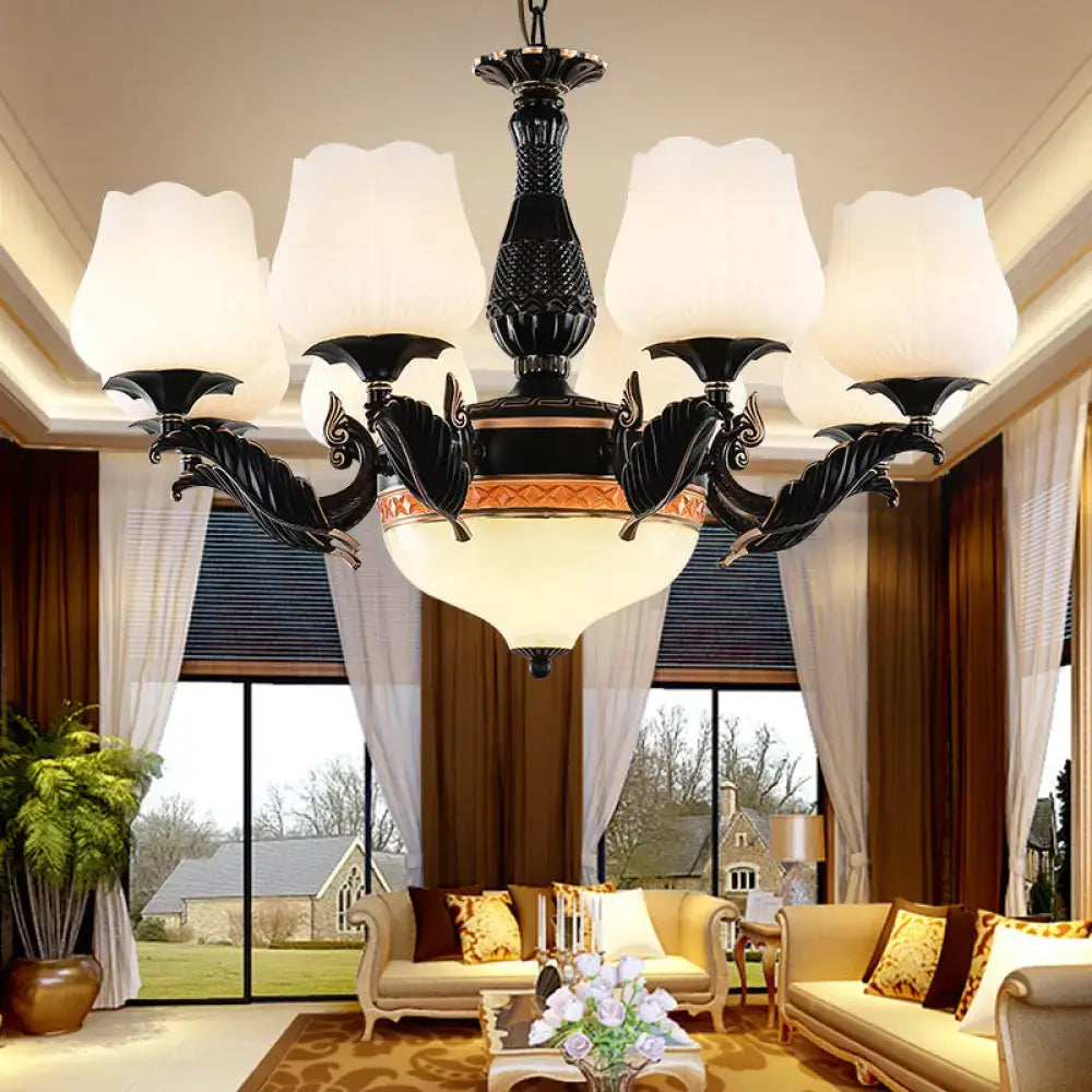 Ornate black & gold chandelier with frosted glass shades dining room