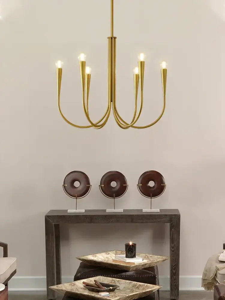 Decorbites brass chandelier for dining room with curved arms