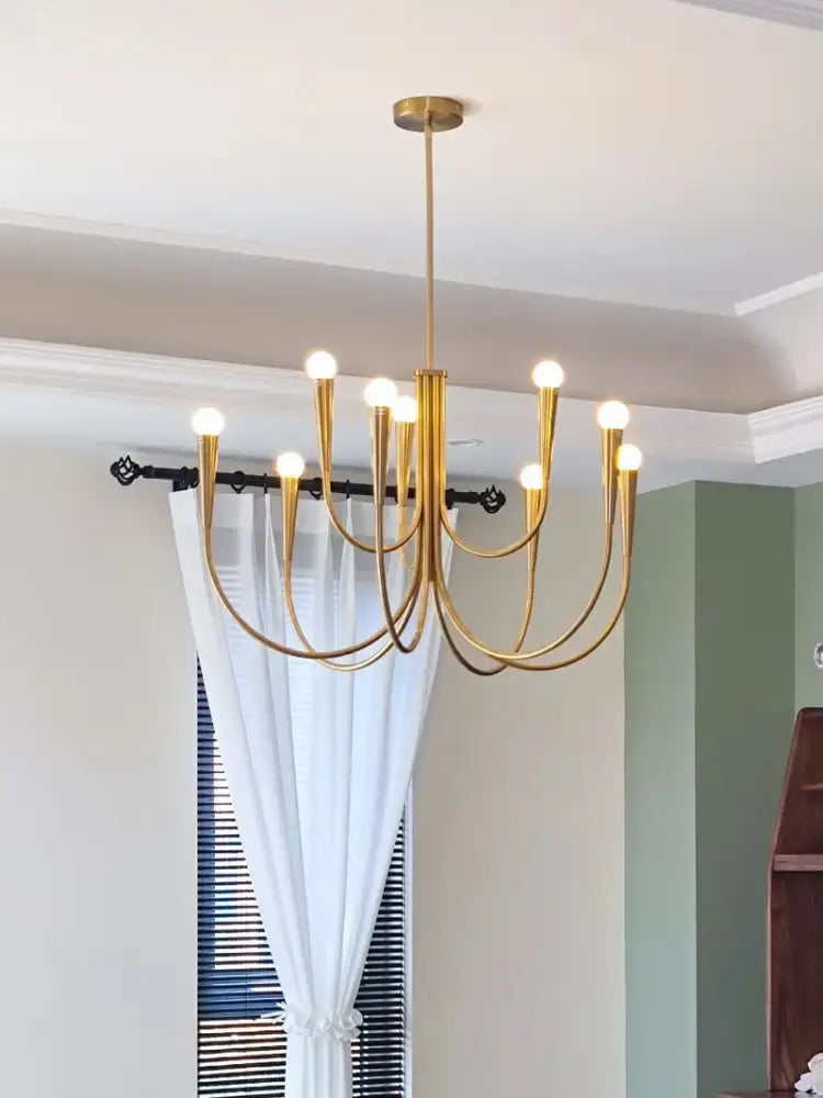 Decorbites brass chandelier for dining room with curved arms