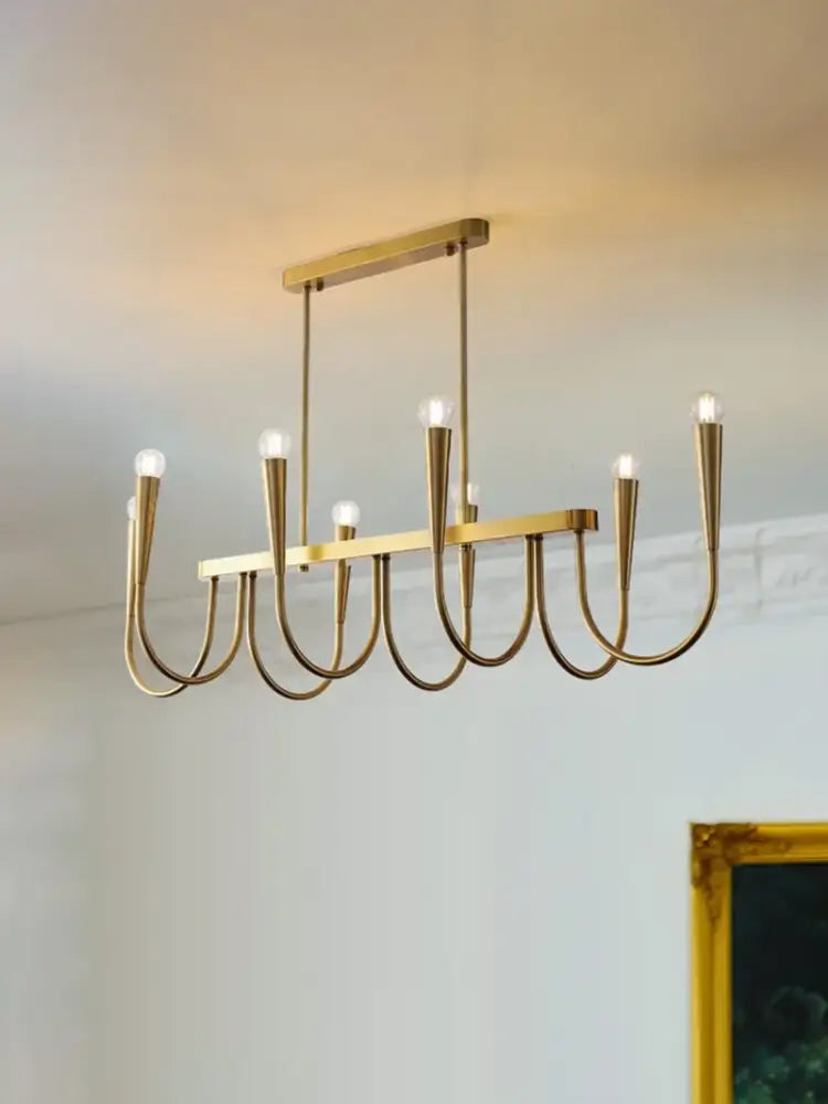 Decorbites brass chandelier for dining room with curved arms