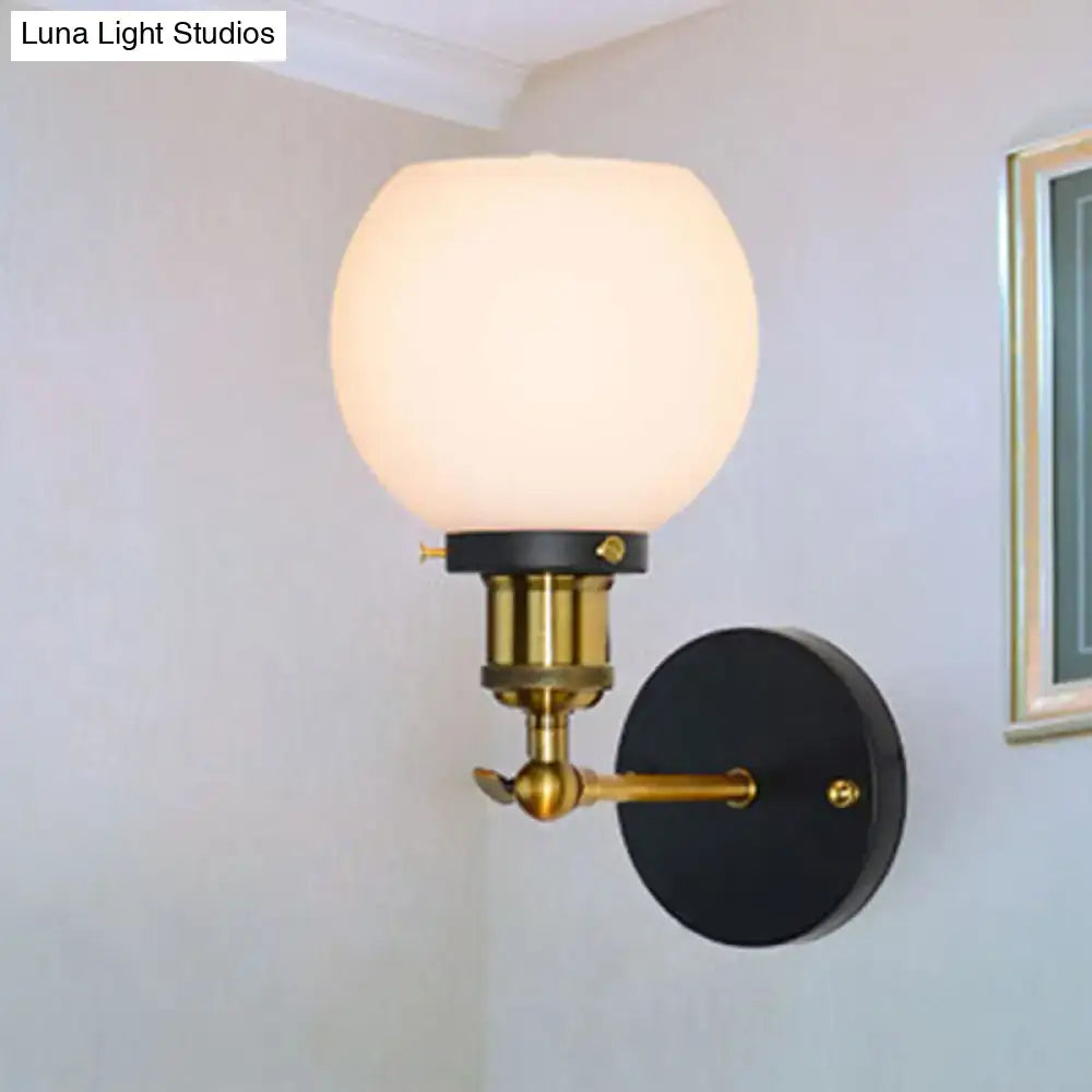 Industrial brass wall sconce with bubble white glass for bedroom
