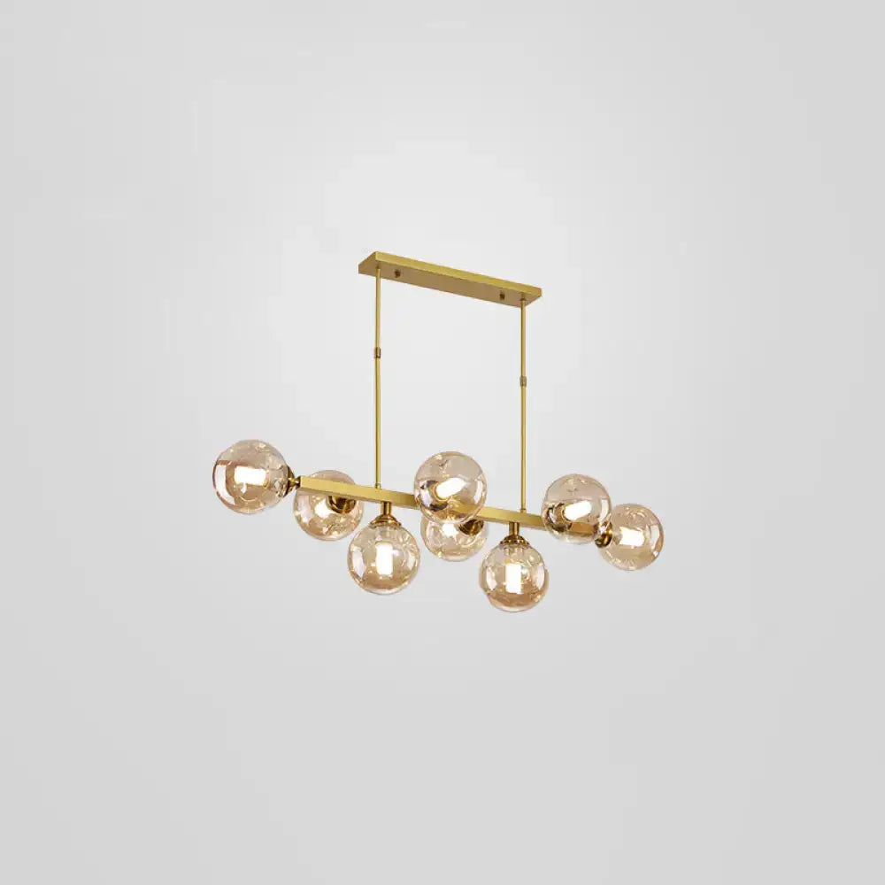 Modern black and brass globe shade pendant light for dining room