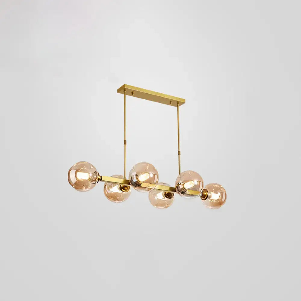 Modern black and brass globe shade pendant light for dining room