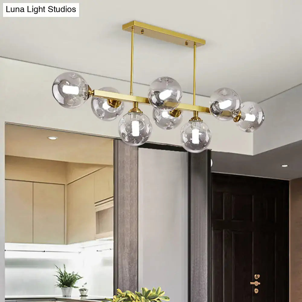 Modern black and brass globe shade pendant light for dining room