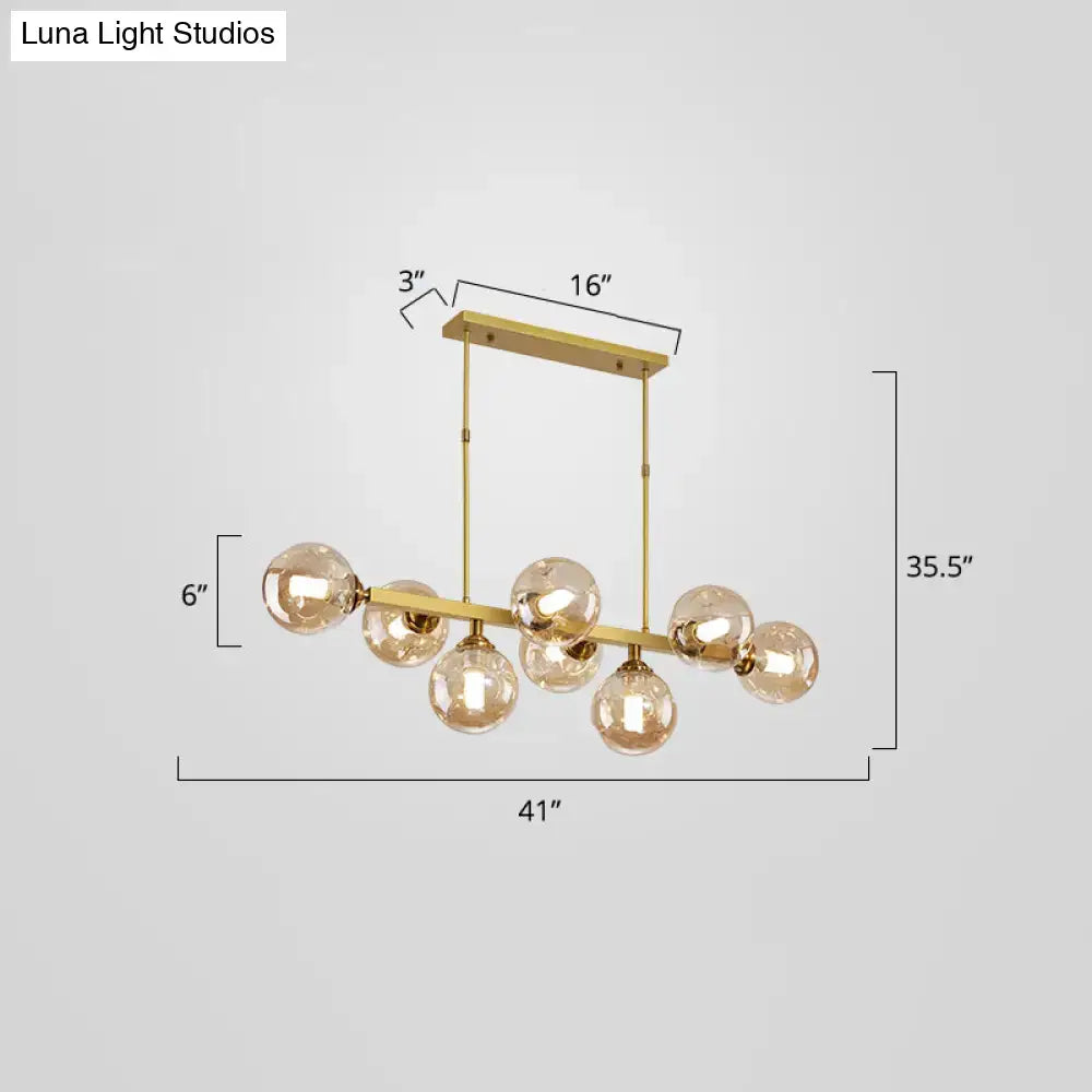 Modern black and brass globe shade pendant light for dining room