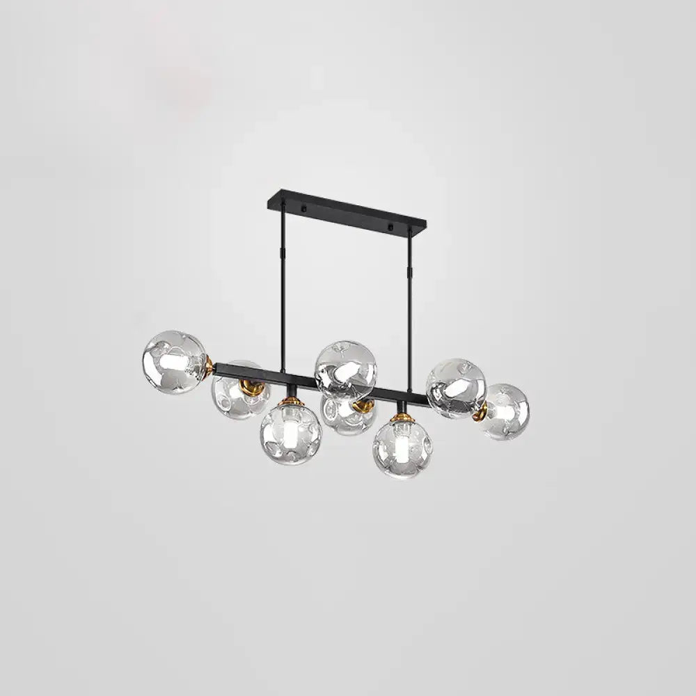 Modern black and brass globe shade pendant light for dining room