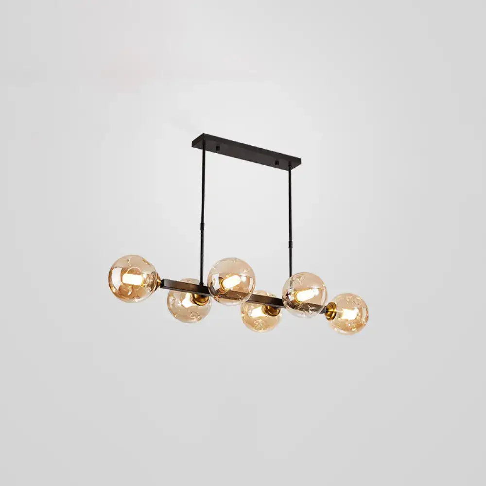 Modern black and brass globe shade pendant light for dining room