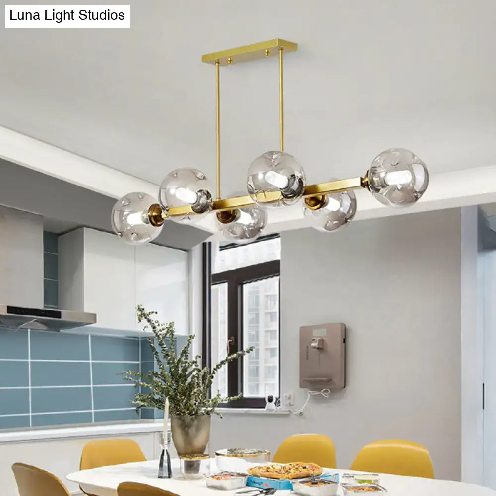 Modern black and brass globe shade pendant light for dining room