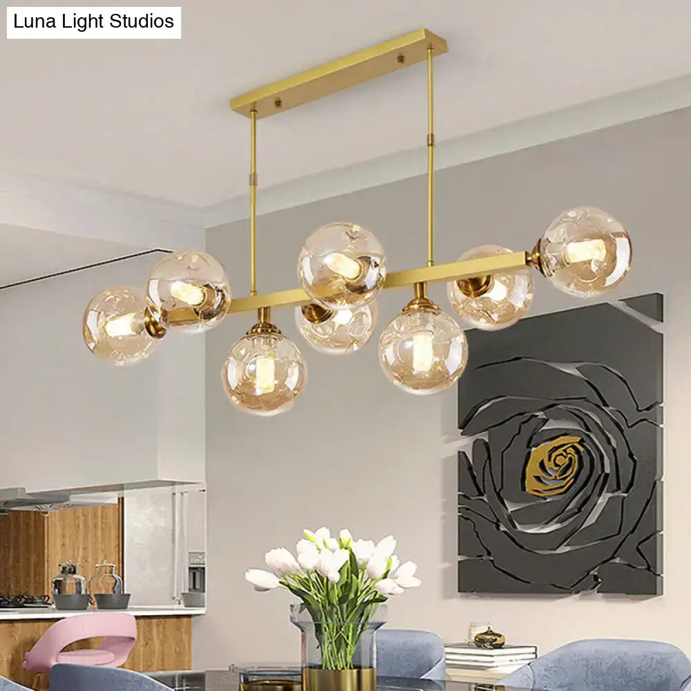 Modern black and brass globe shade pendant light for dining room