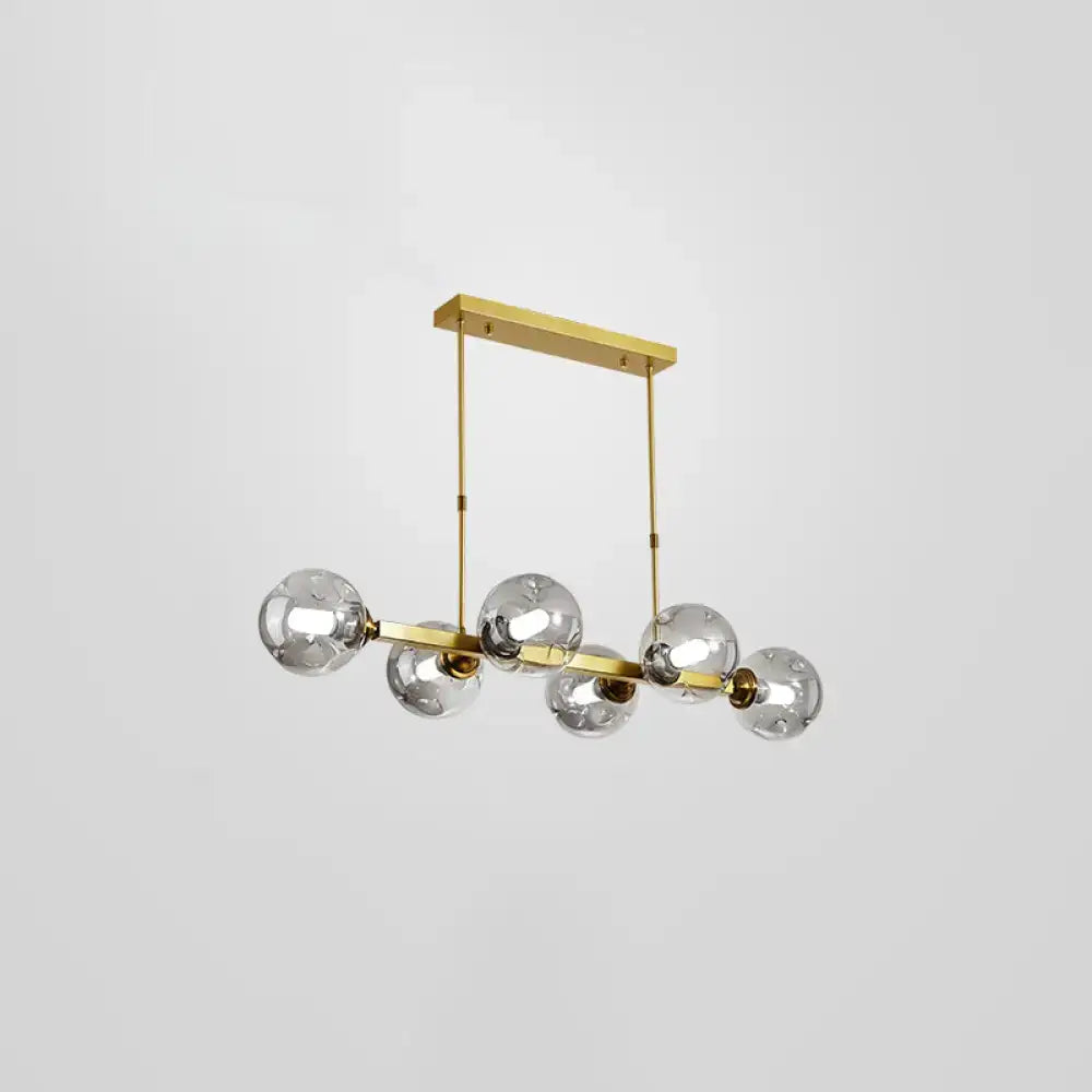 Modern black and brass globe shade pendant light for dining room