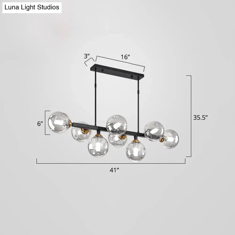 Modern black and brass globe shade pendant light for dining room