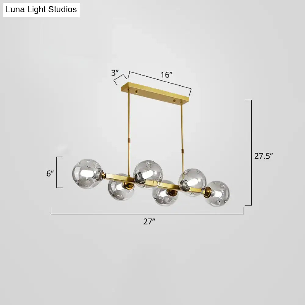 Modern black and brass globe shade pendant light for dining room