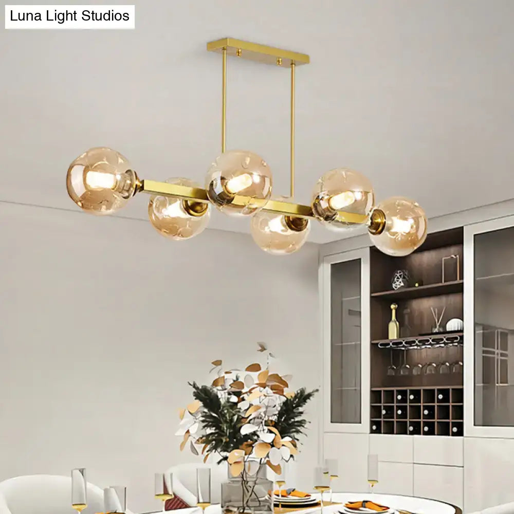 Modern black and brass globe shade pendant light for dining room