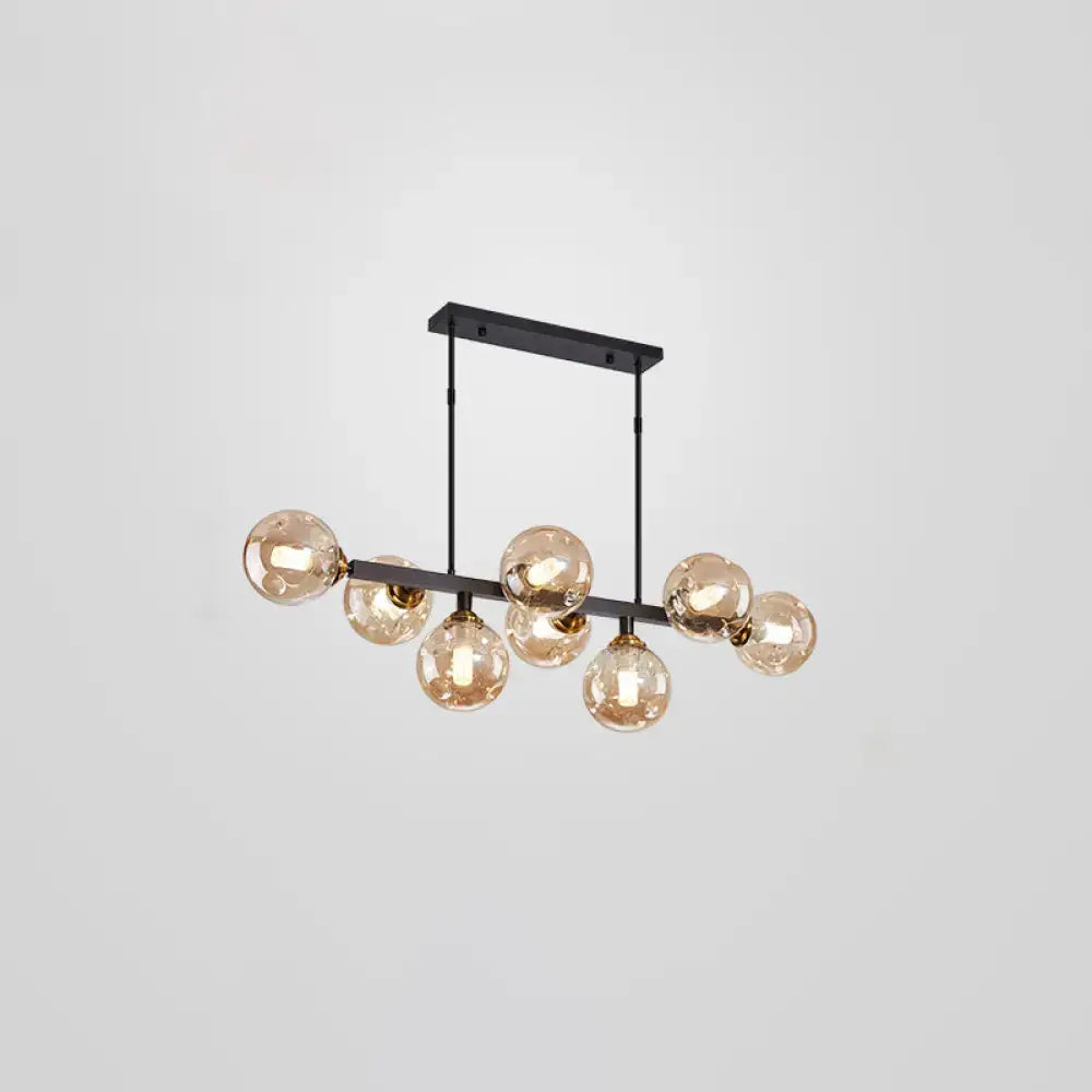 Modern black and brass globe shade pendant light for dining room