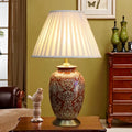 Vintage red ceramic table lamp for bedroom with ornate pattern