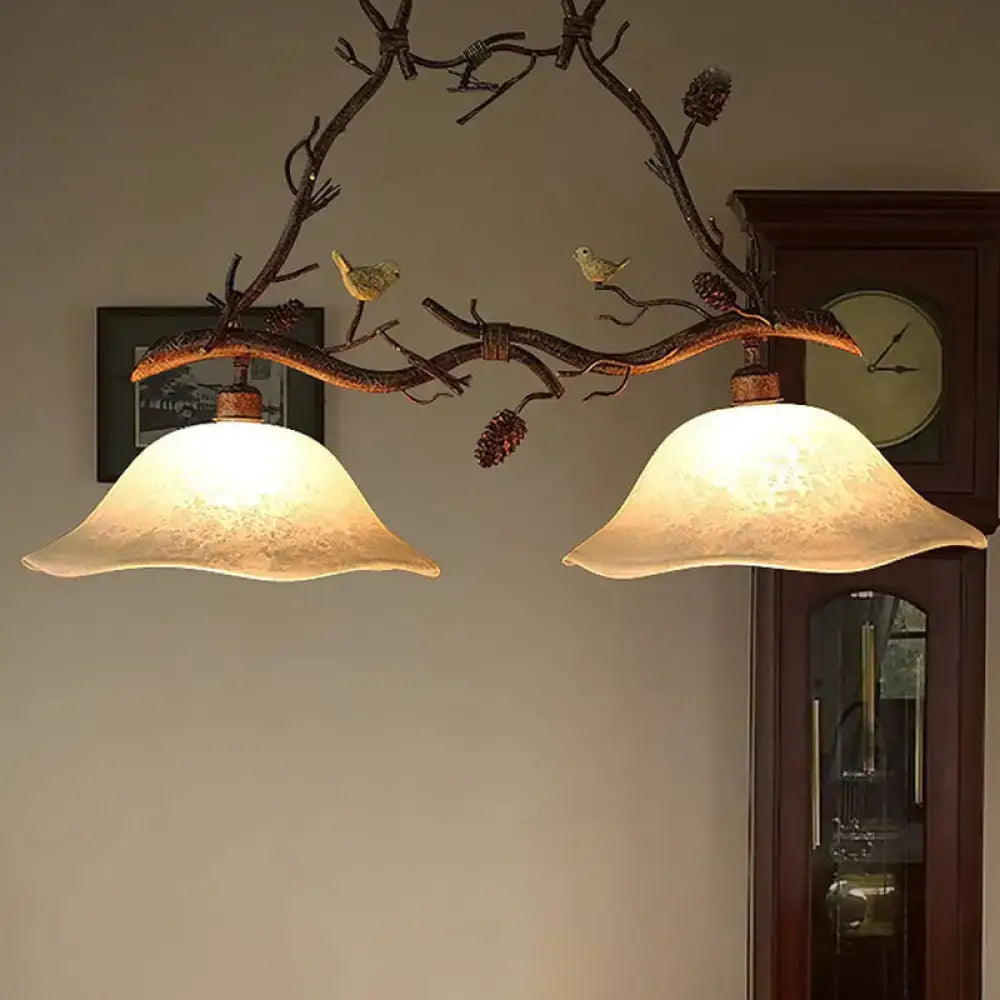 Rustic bronze branch suspension light dining room with bird accents