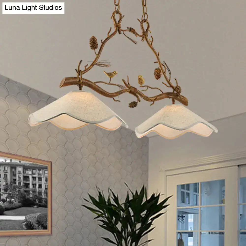 Rustic bronze branch suspension light dining room with bird accents