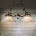 Rustic bronze branch suspension light dining room with bird accents