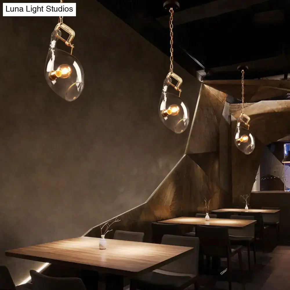 Modern brass and clear glass fish pendant light dining room