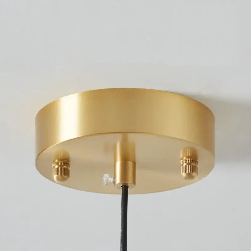 Sleek amber glass and copper pendant light for kitchens