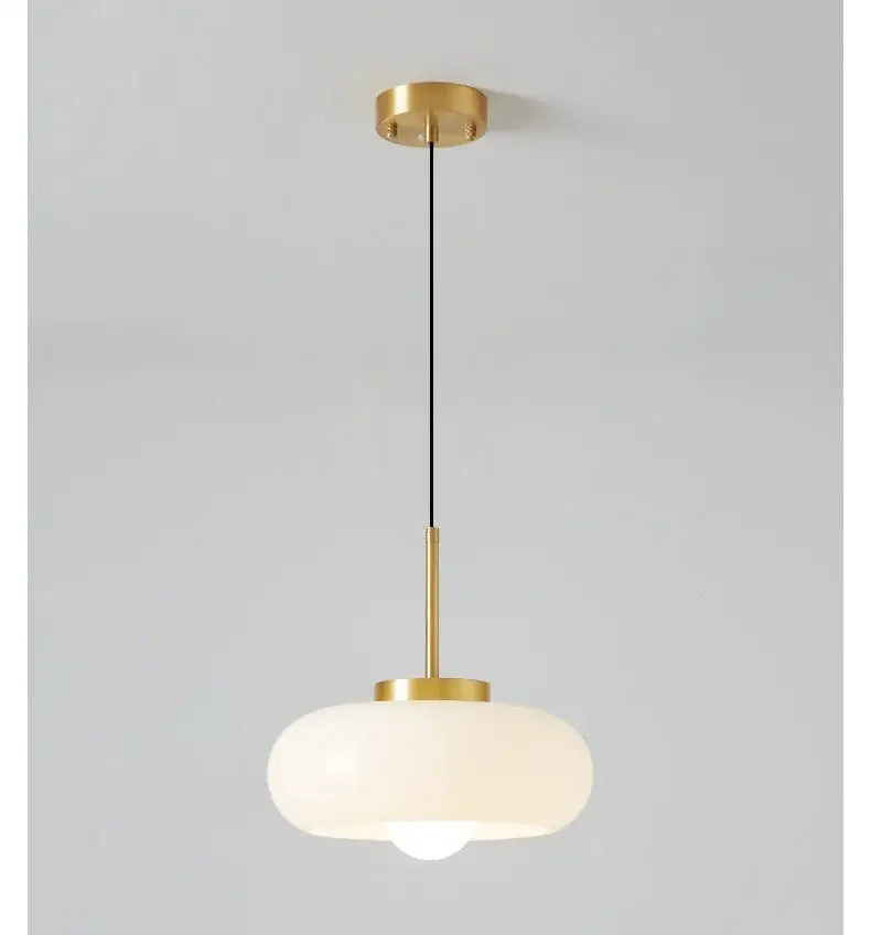 Sleek amber glass and copper pendant light for kitchens