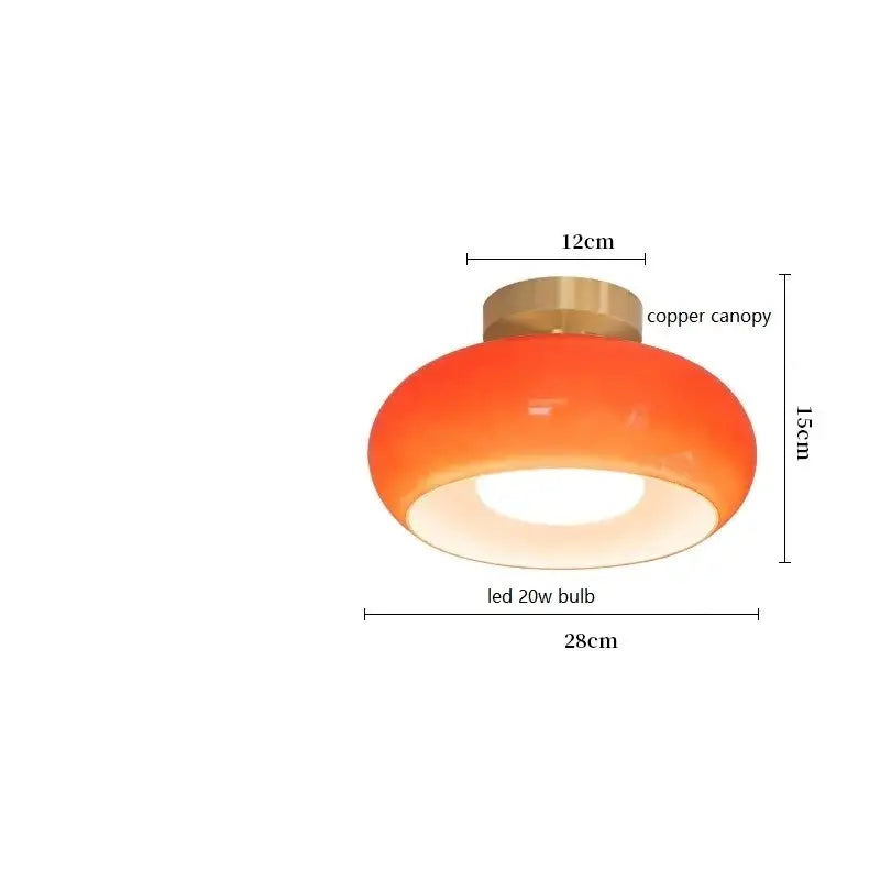 Sleek amber glass and copper pendant light for kitchens