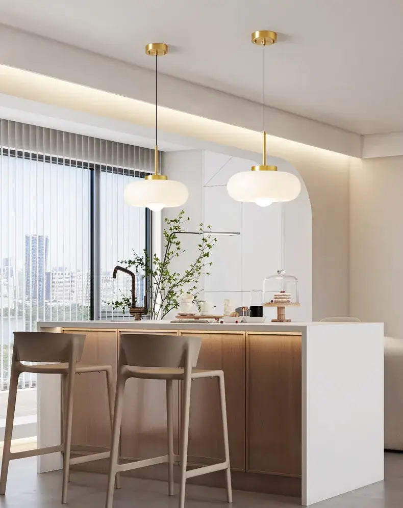 Sleek amber glass and copper pendant light for kitchens