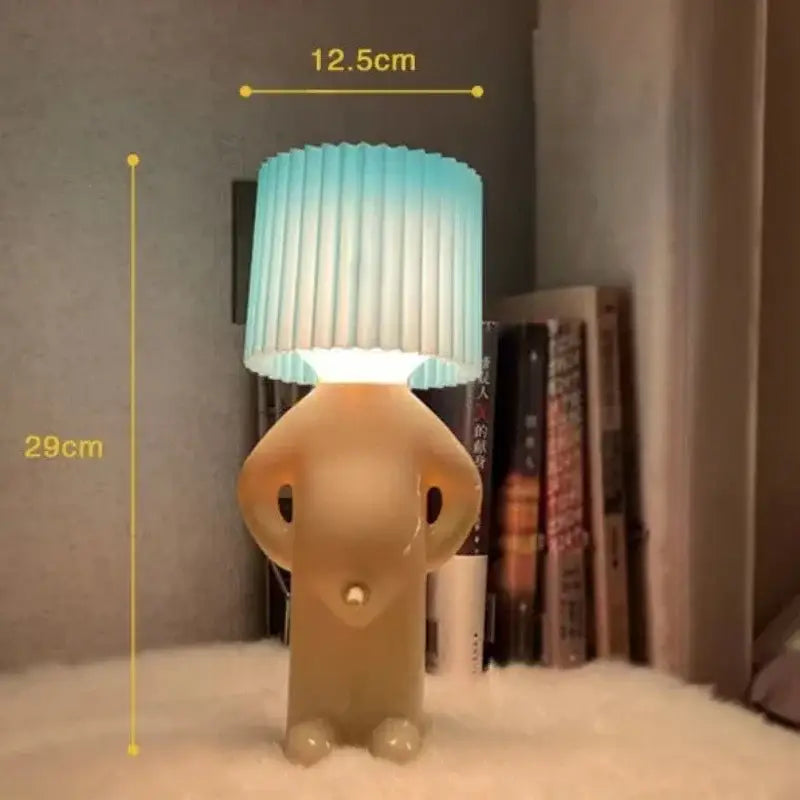 Whimsical beige and yellow naughty boy table lamp for bedroom bedside