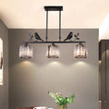 Black crystal prism island light fixture with leaf decor dining room