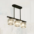 Simple black metal chandelier with three crystal shades dining room