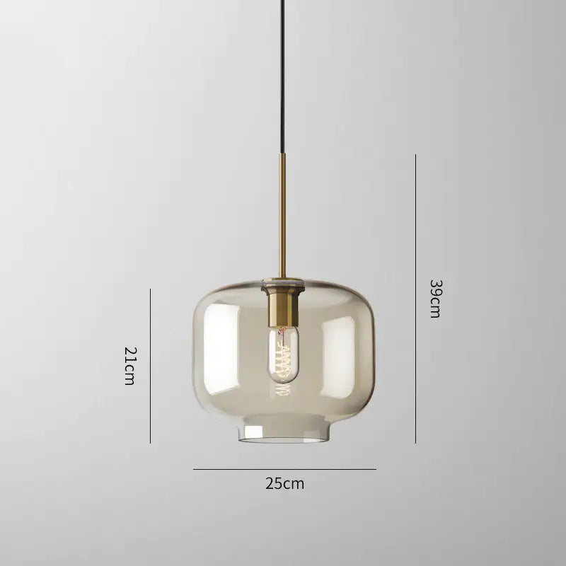 Modern smoked glass pendant lights with brass accents for kitchen island