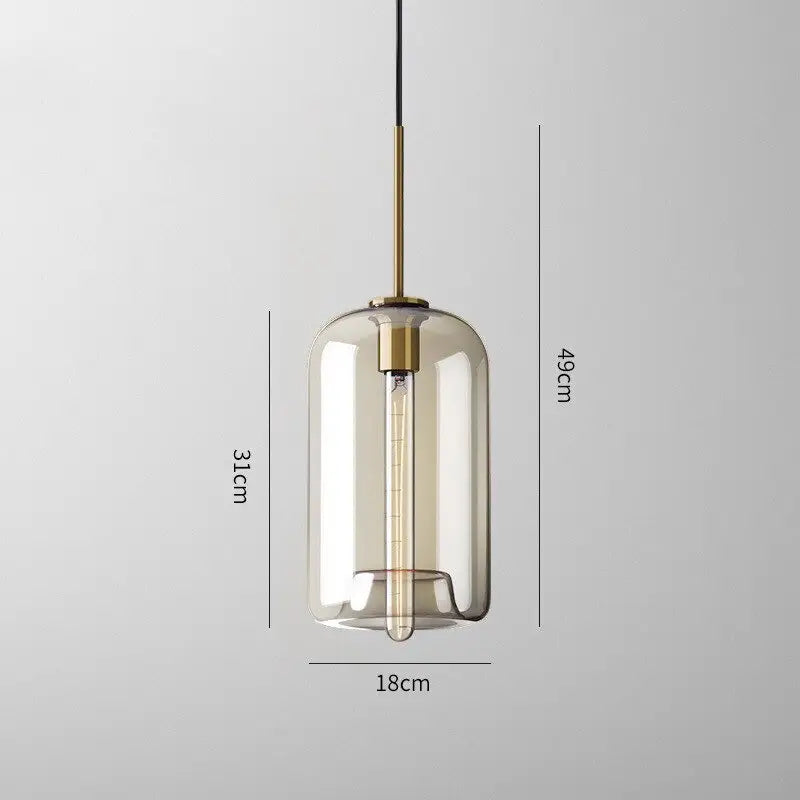 Modern smoked glass pendant lights with brass accents for kitchen island
