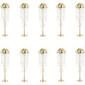 Elegant gold metal vases with crystals and roses for dining room