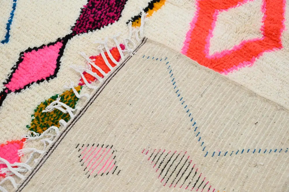 Handmade moroccan azilal rug with vibrant colors for living room