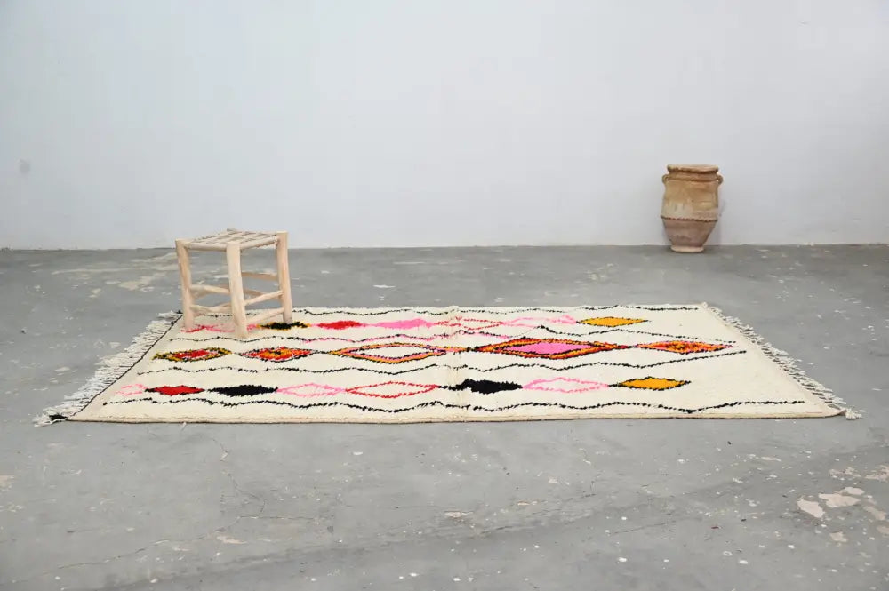 Handmade beige azilal rug with geometric patterns bedroom decor