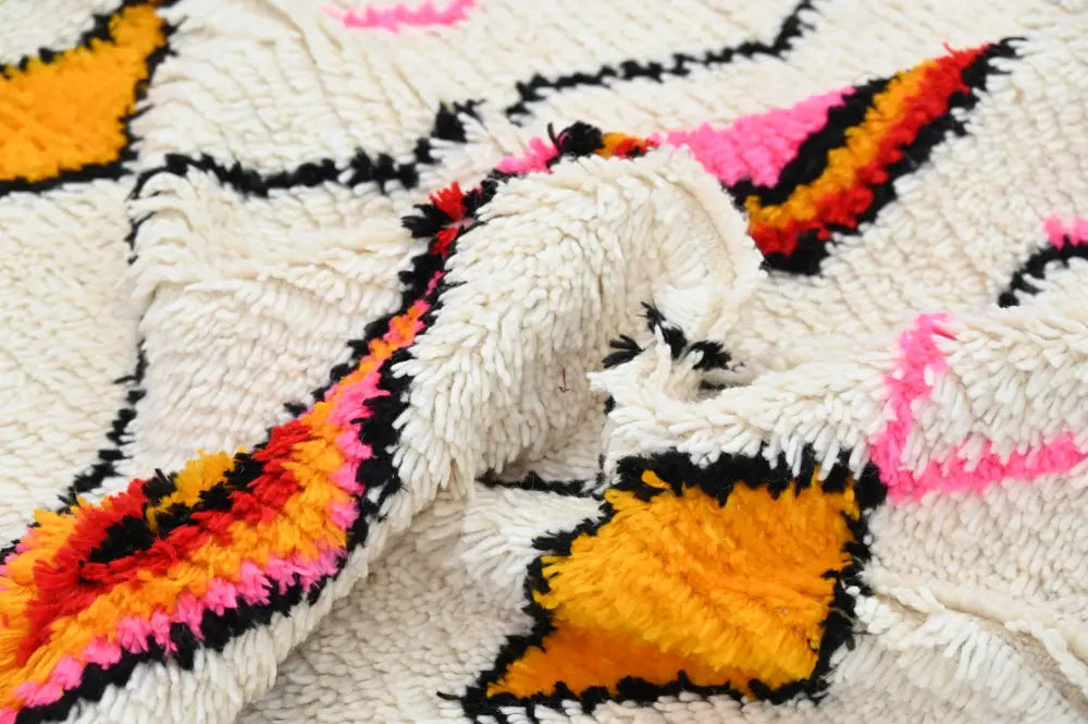 Handmade beige azilal rug with geometric patterns bedroom decor