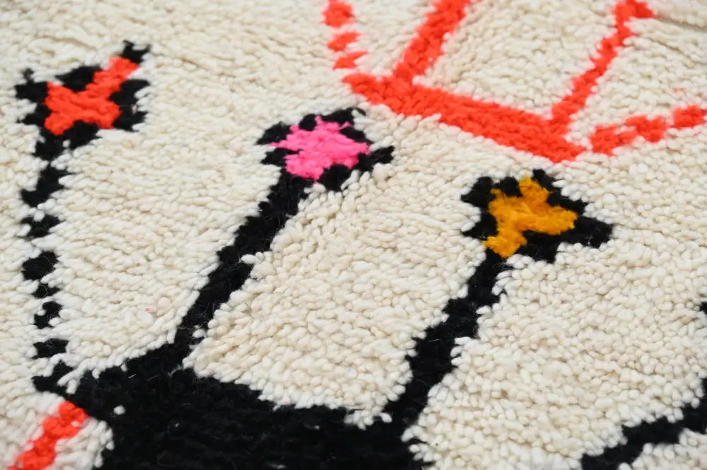 Handmade moroccan azilal rug beige and pink living room decor