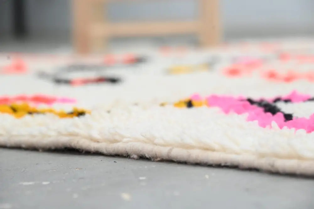 Handmade moroccan azilal rug beige and pink living room decor