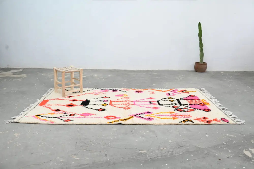 Handmade moroccan azilal rug beige and pink living room decor