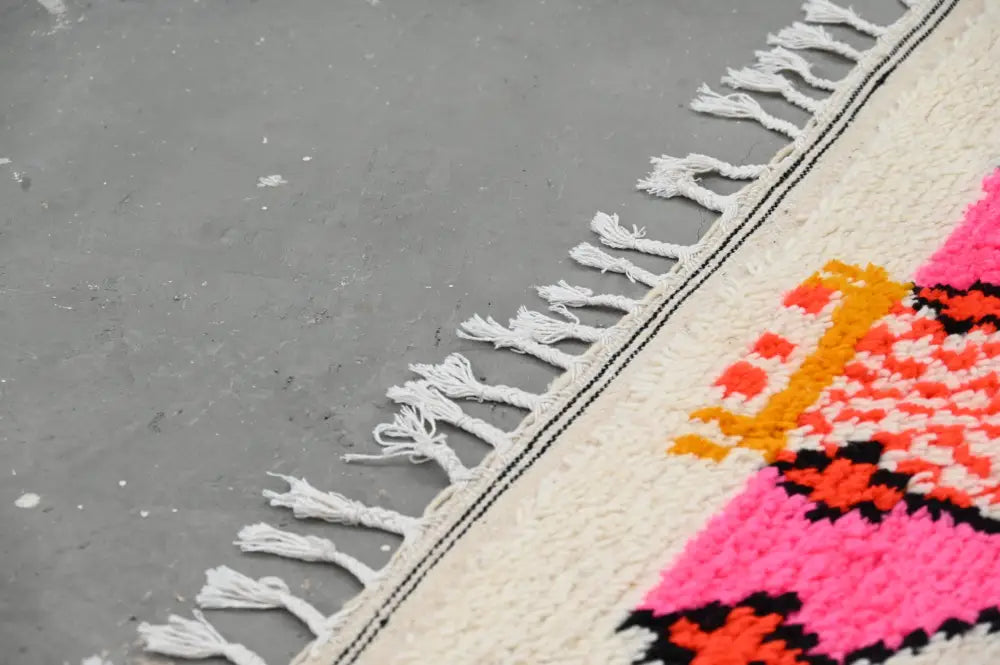 Handmade moroccan azilal rug beige and pink living room decor