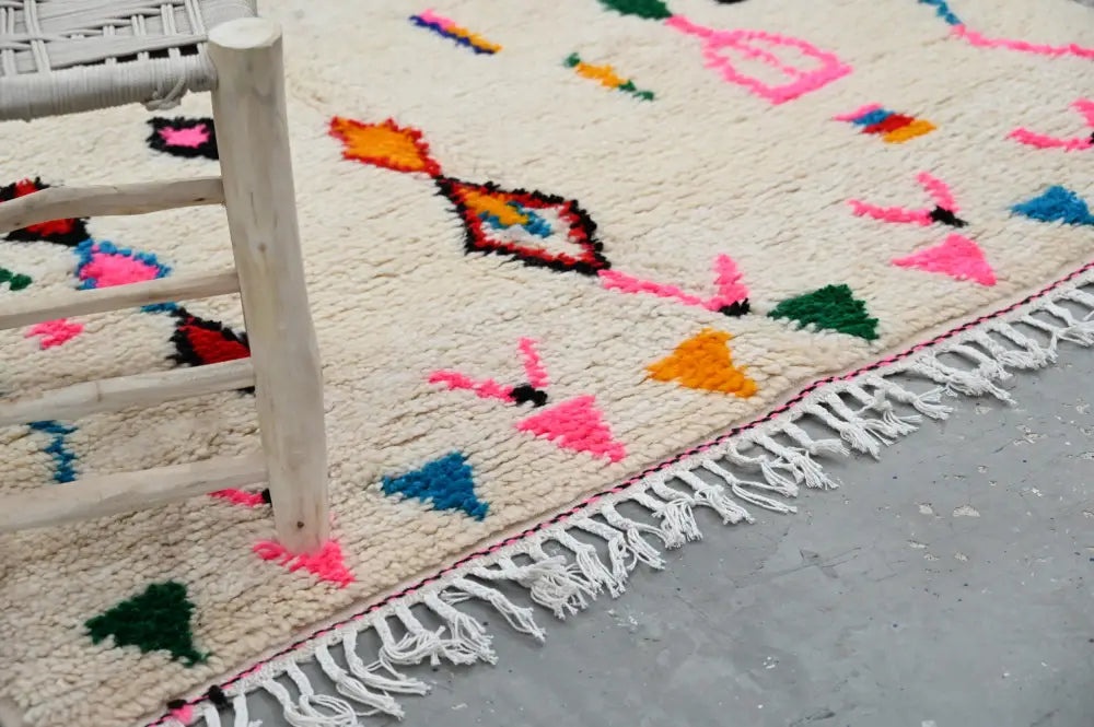 Handmade beige moroccan azilal rug with colorful patterns living room