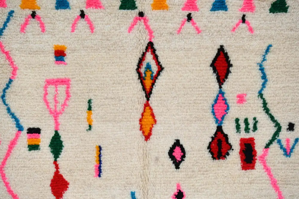 Handmade beige moroccan azilal rug with colorful patterns living room