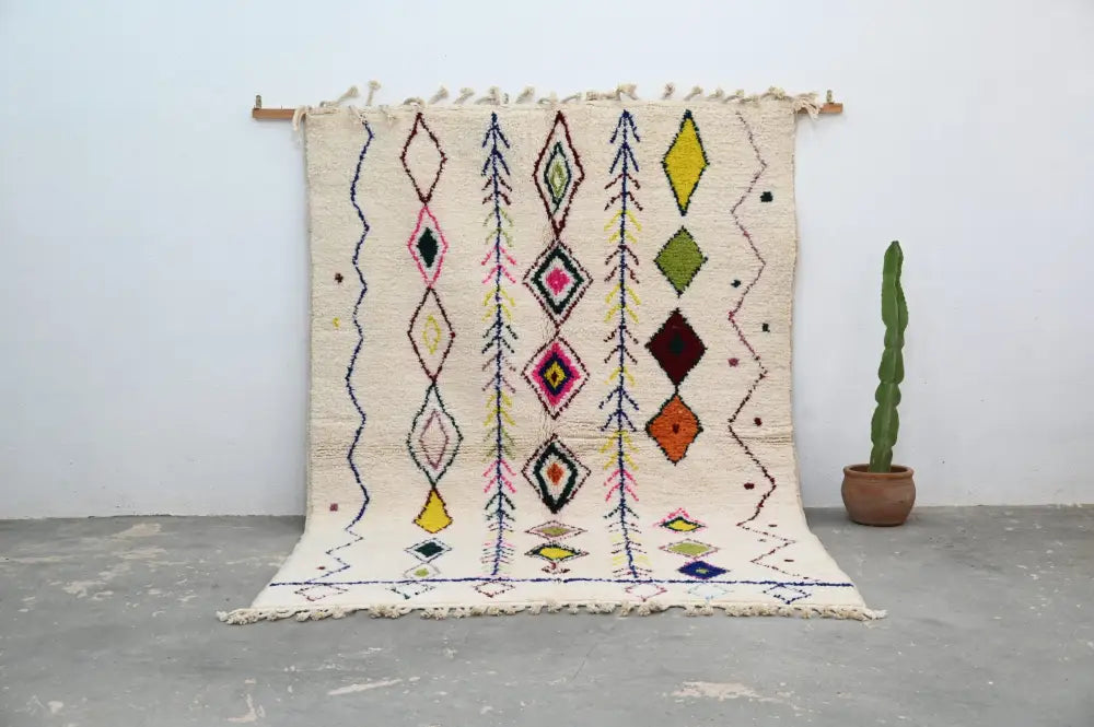 Handmade beige moroccan azilal rug with colorful diamonds living room