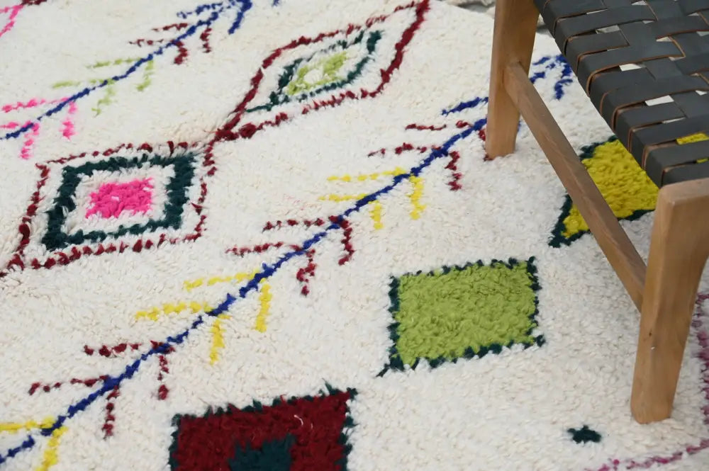Handmade beige moroccan azilal rug with colorful diamonds living room