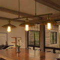 Industrial brass scalloped suspended lighting fixture kitchen bistro