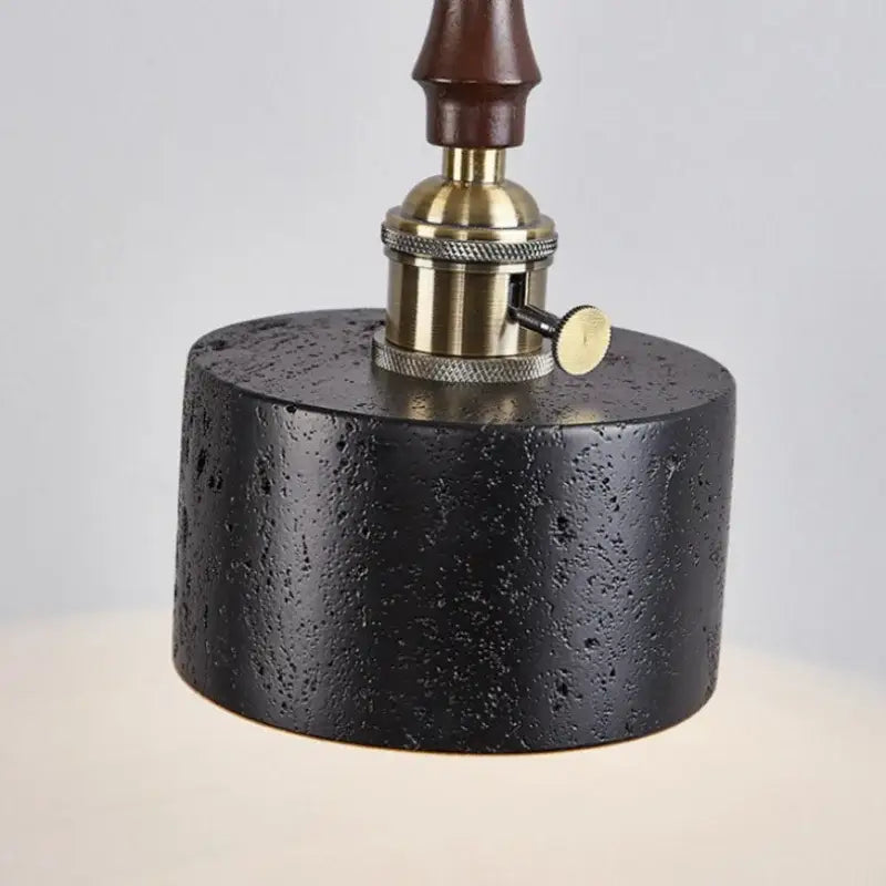 Black travertine cylindrical pendant light for dining room